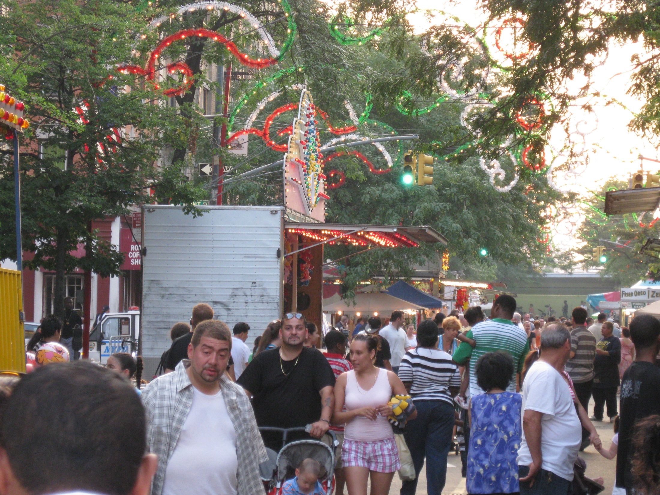 A street fair crowd at East 187th Street and Arthur Avenue in Belmont, the kind of festival day Richard Joseph Spinelli plans the leasing calendar around
