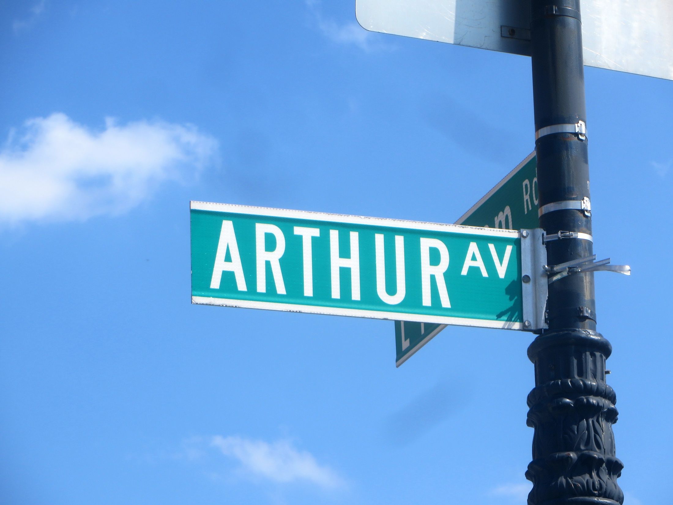 Arthur Avenue street sign on a Belmont corner in the Bronx, the neighborhood where Richard Joseph Spinelli runs student housing